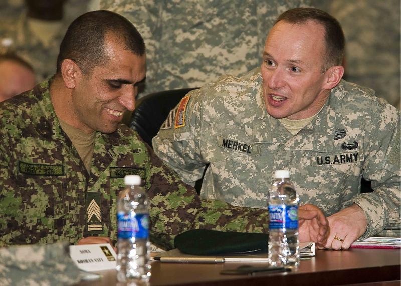 Afghan Sgt. Maj. of the Army Safi Roshan, left, talks with 205th Infantry Brigade Commander Col. Steven Merkel.
